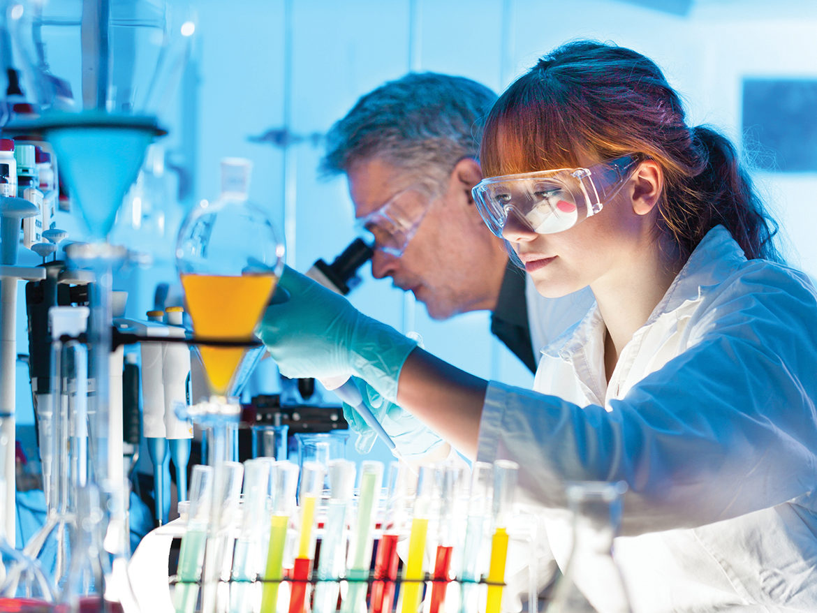 Lady wearing goggles in science lab