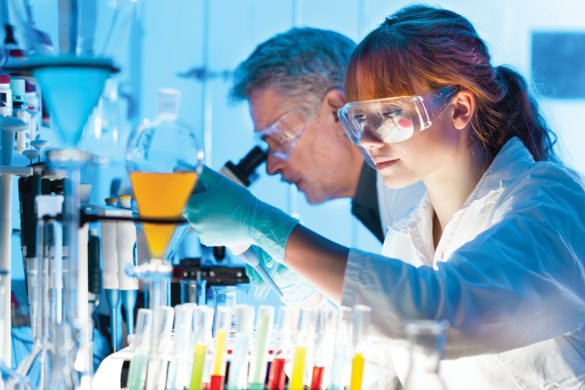 Lady wearing goggles in science lab