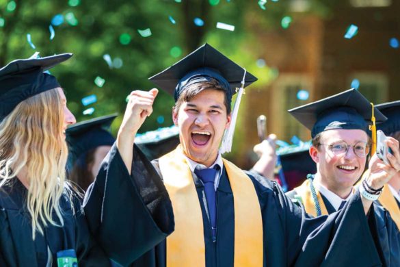 Three graduates at Regent University's 2023 Commencement.