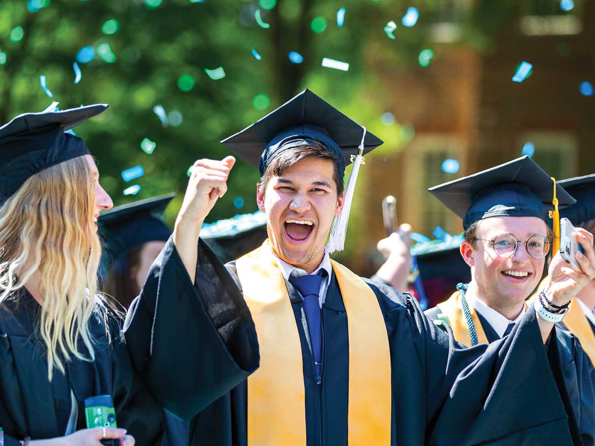 Three graduates at Regent University's 2023 Commencement.