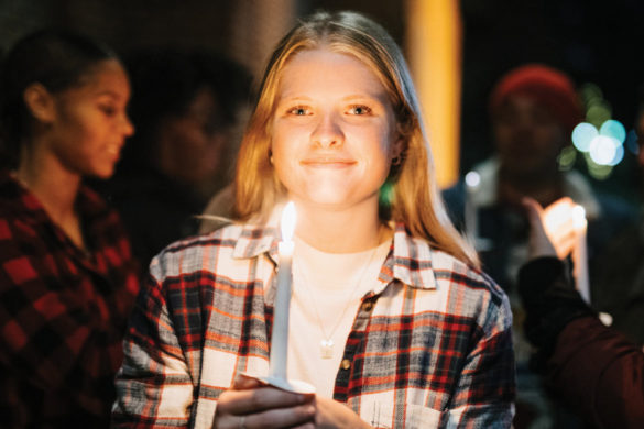 Young woman holding a candle