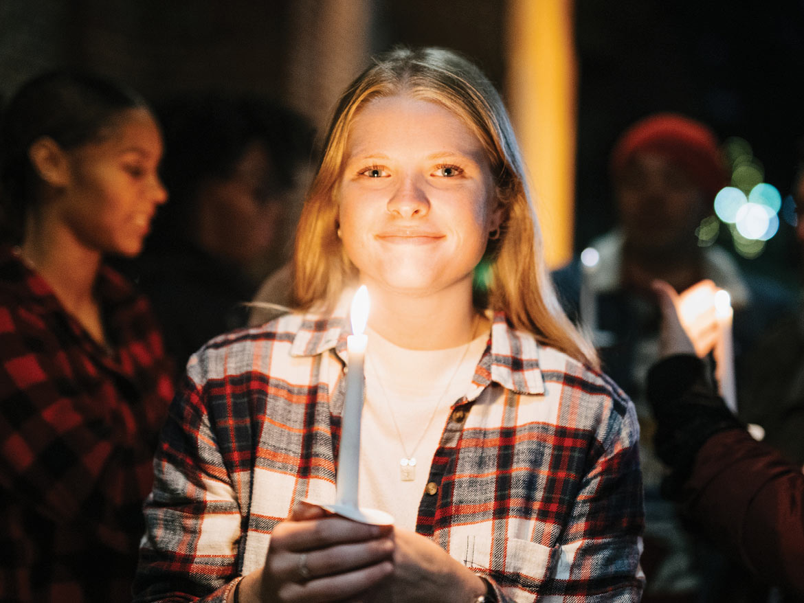 Young woman holding a candle