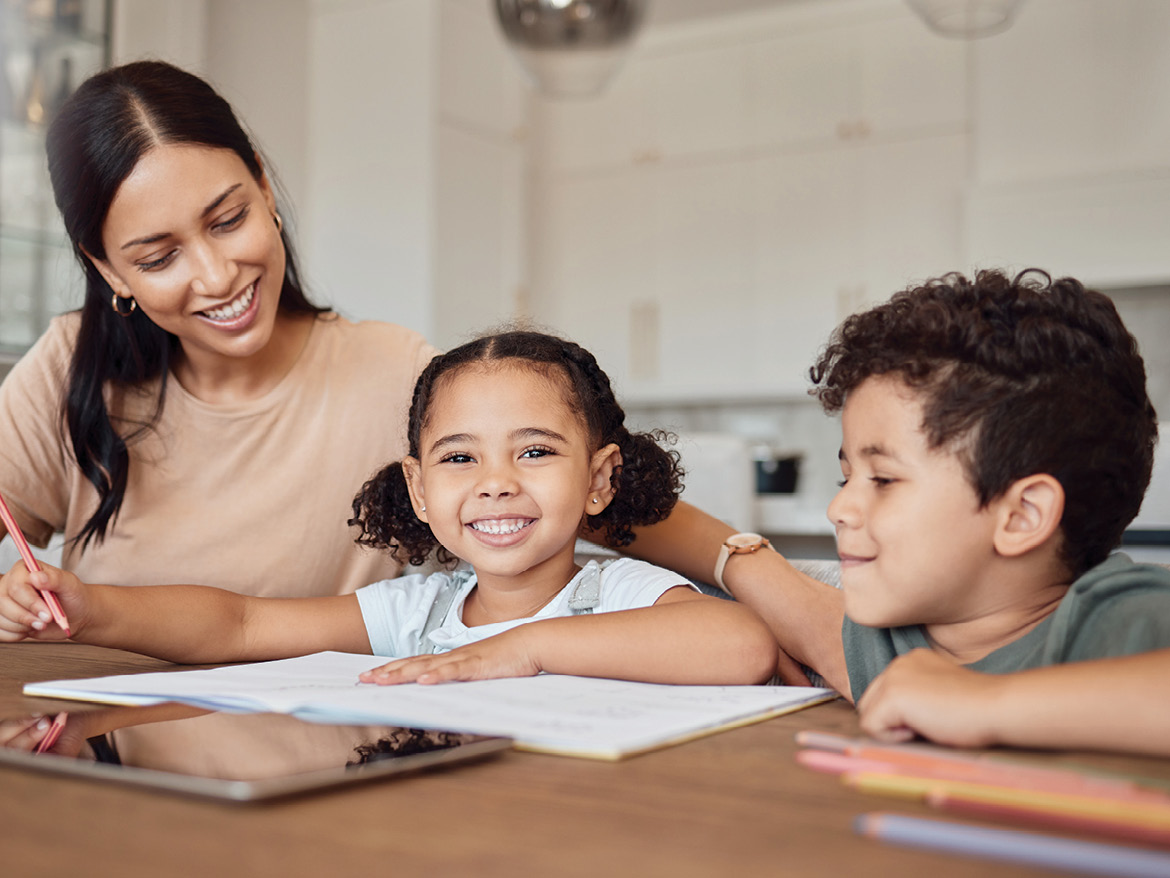 mom and kids doing schoolwork